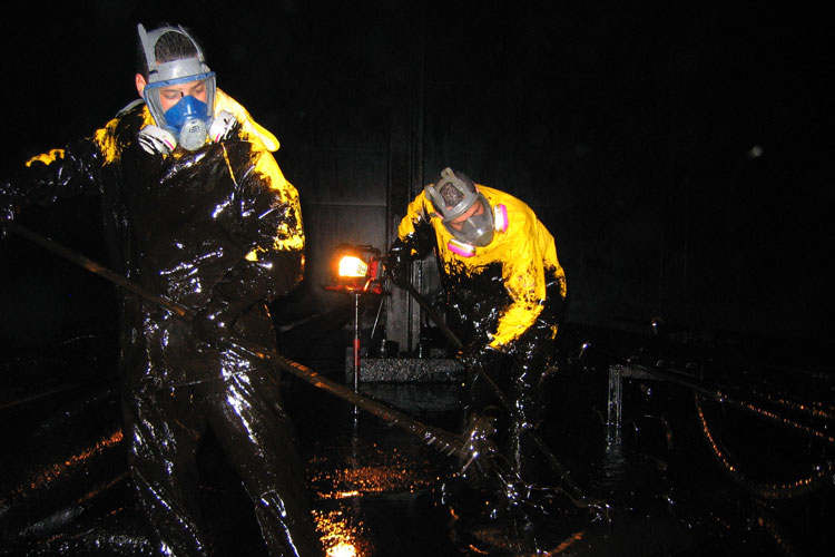 petroleum yank cleaning by hand inside of a petroleum vessel in Contra Costa County