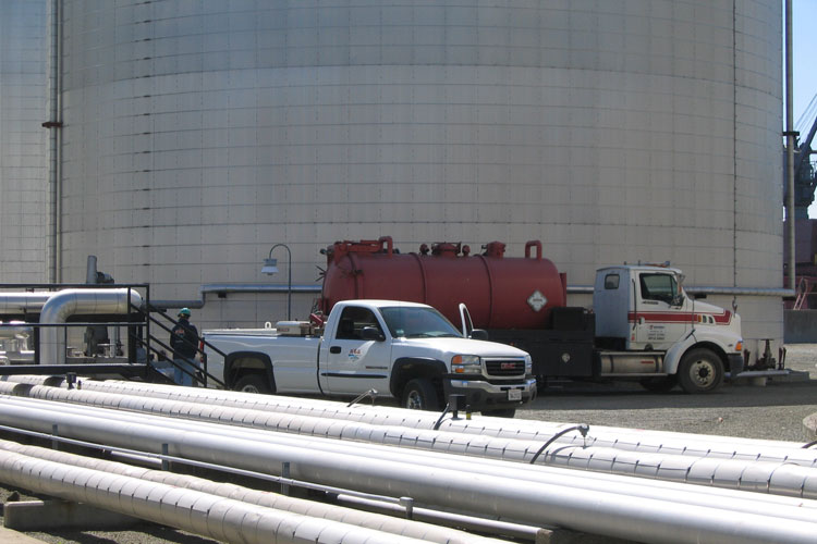 disposing of liquid and solid waste using a vacuum truck